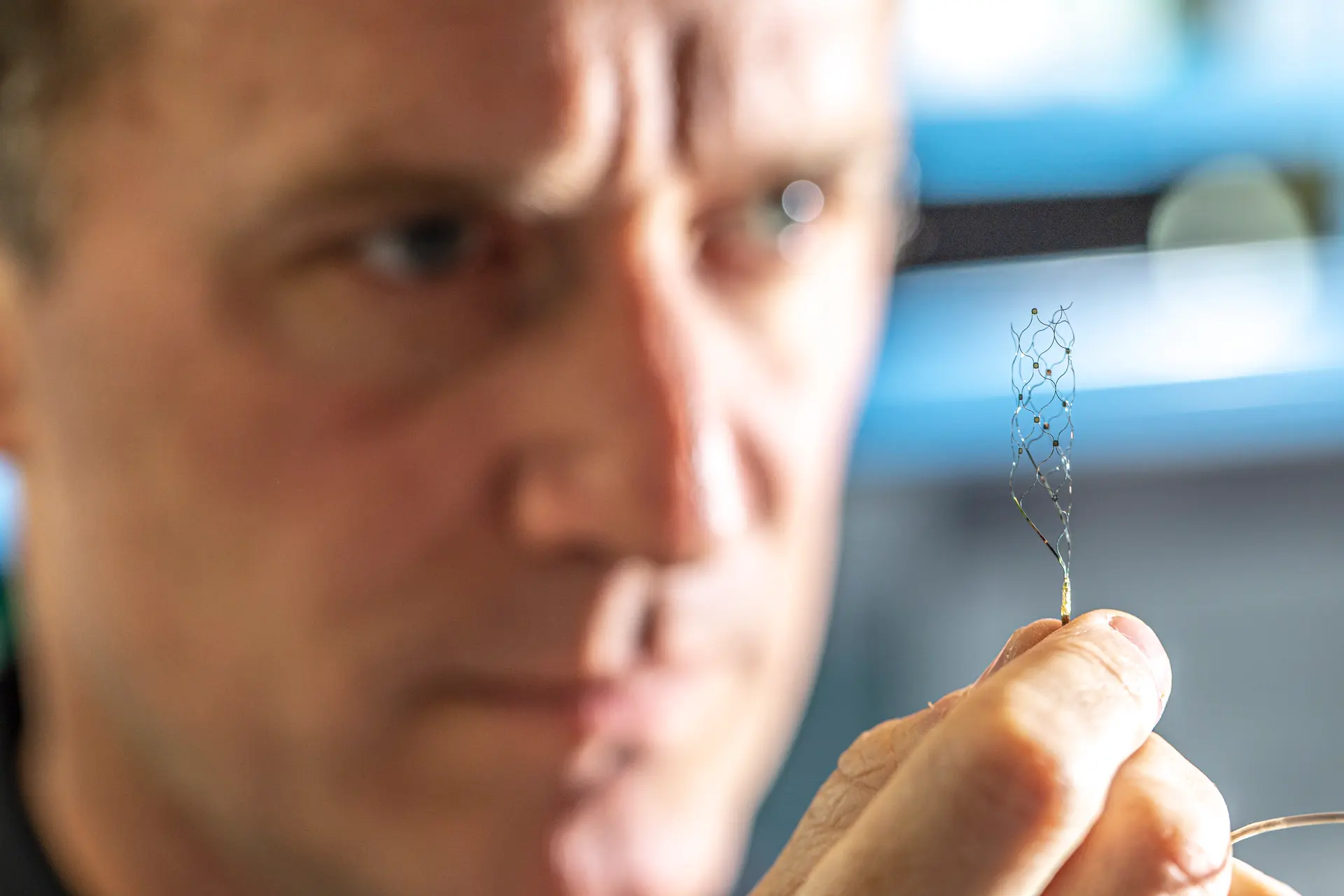 Man holds Synchron Stentrode device